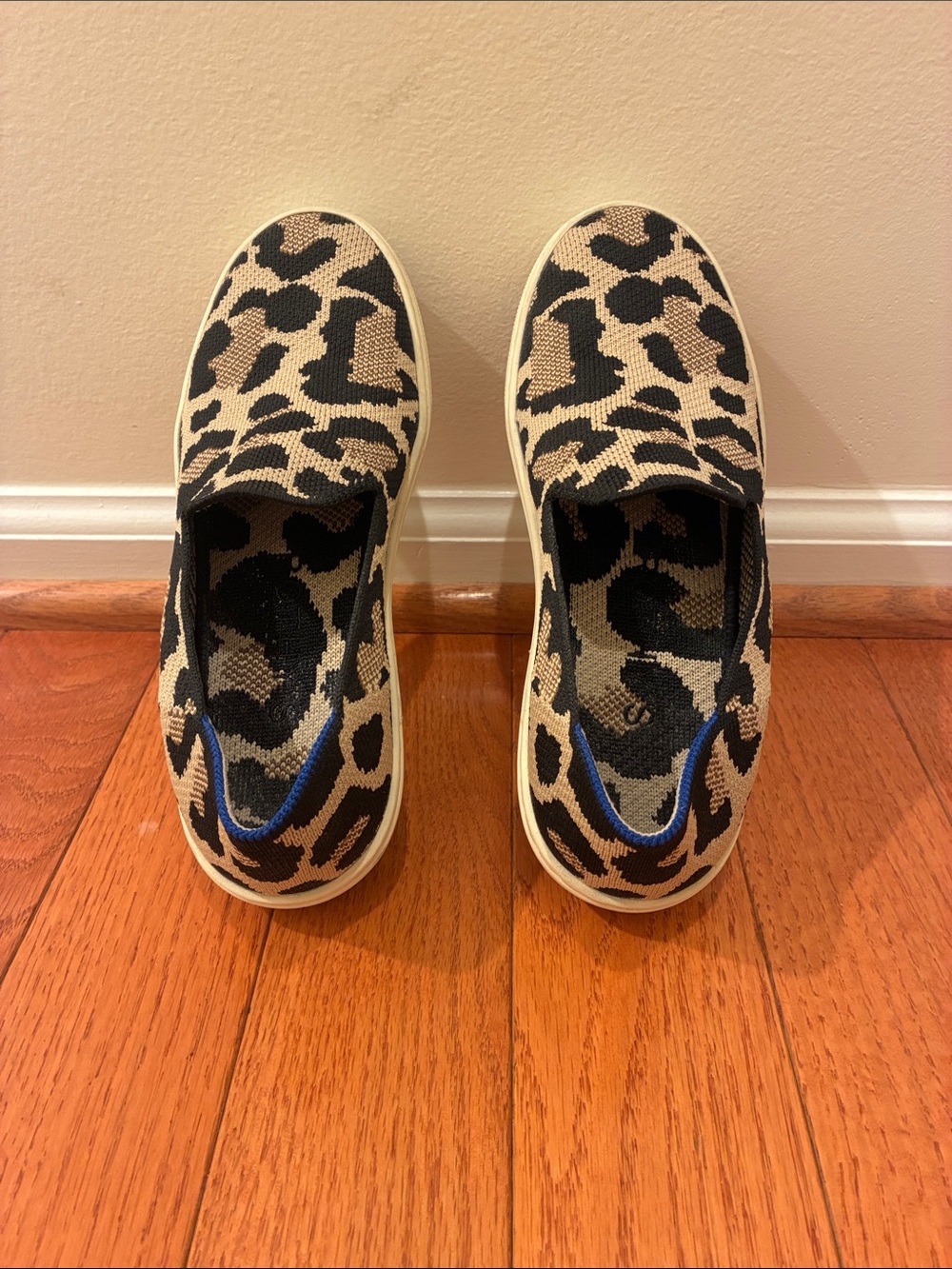 Woman Rothy’s Slip-On Sneakers in Black and Tan Leopard Print size 5